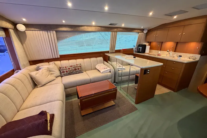 Slide: The Image of Luxurious interior of a 2001 Ocean Yachts 48 Super Sport with plush seating and modern kitchen. - 32