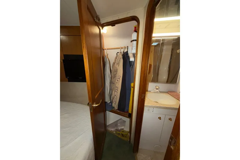 Slide: The Image of Interior of 2001 Ocean Yachts 48 Super Sport showing closet and bathroom area. - 46