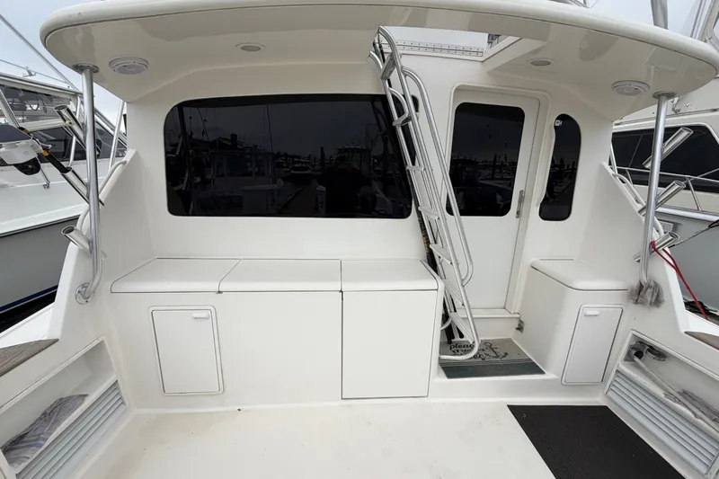 Slide: The Image of 2001 Ocean Yachts 48 Super Sport cockpit with ladder and storage compartments. - 14