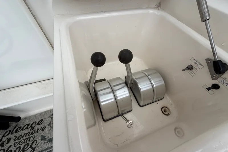 Slide: The Image of Controls of a 2001 Ocean Yachts 48 Super Sport boat, featuring dual levers. - 17