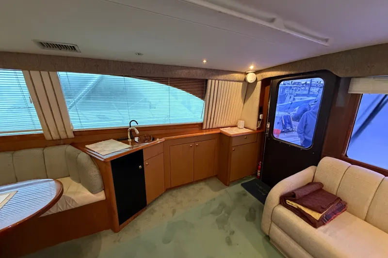 Slide: The Image of Interior of 2001 Ocean Yachts 48 Super Sport with cozy seating and kitchenette. - 36