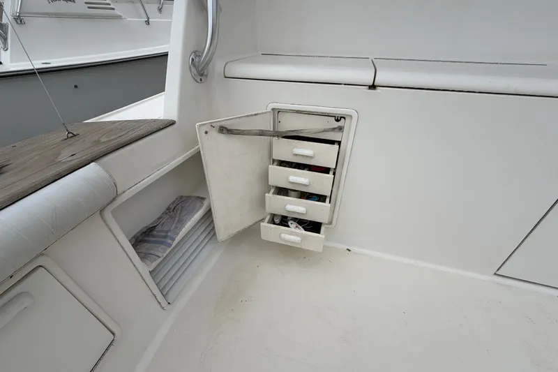 Slide: The Image of Open storage compartment on 2001 Ocean Yachts 48 Super Sport boat deck. - 16