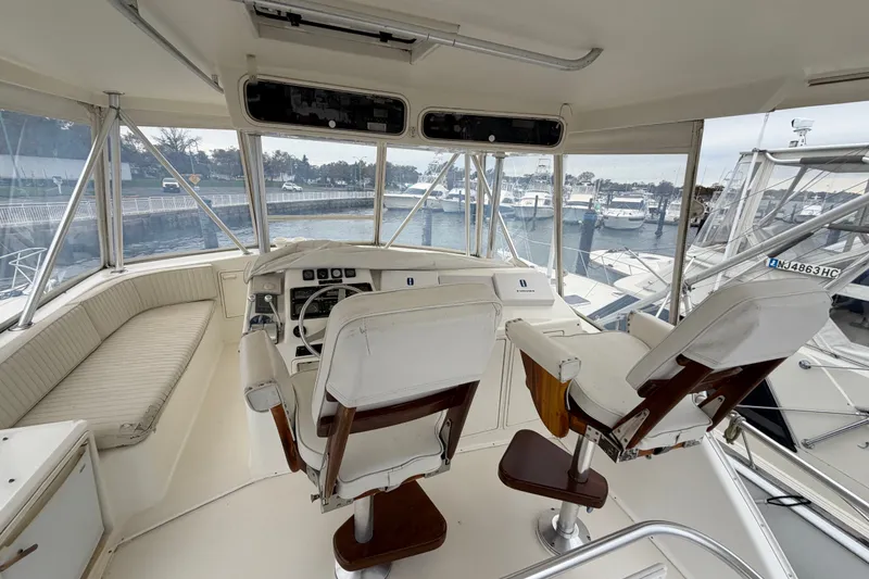 Slide: The Image of Interior view of 2001 Ocean Yachts 48 Super Sport cockpit with helm and seating. - 68