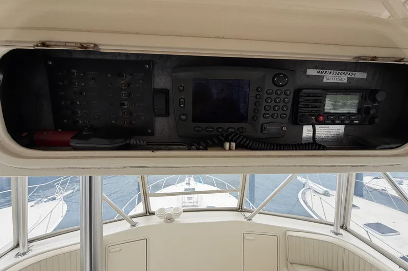 Slide: The Image of Control panel of a 2001 Ocean Yachts 48 Super Sport with navigation equipment. - 67
