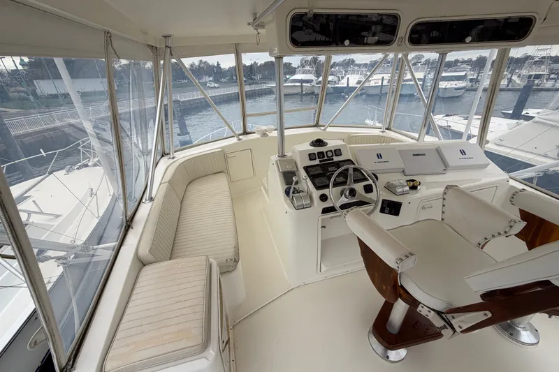 Slide: The Image of Helm of 2001 Ocean Yachts 48 Super Sport with seating and navigation equipment. - 24
