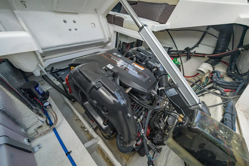 Slide: The Image of Engine compartment of a 2015 Regal 2700 ES Bowrider boat, showcasing detailed components. - 22