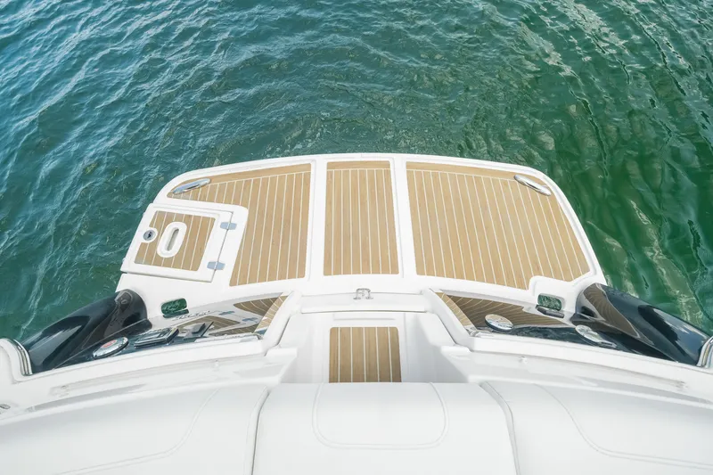 Slide: The Image of 2015 Regal 2700 ES Bowrider swim platform on calm water. - 16