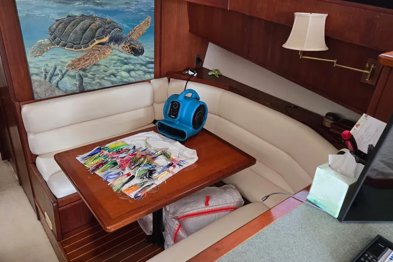 Slide: The Image of Cozy interior of 1989 Viking 45 Convertible with fishing lures and turtle artwork. - 22