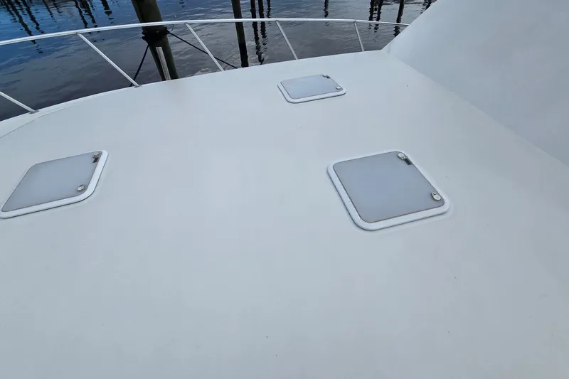 Slide: The Image of Deck of 1989 Viking 45 Convertible boat with hatches and railing. - 33