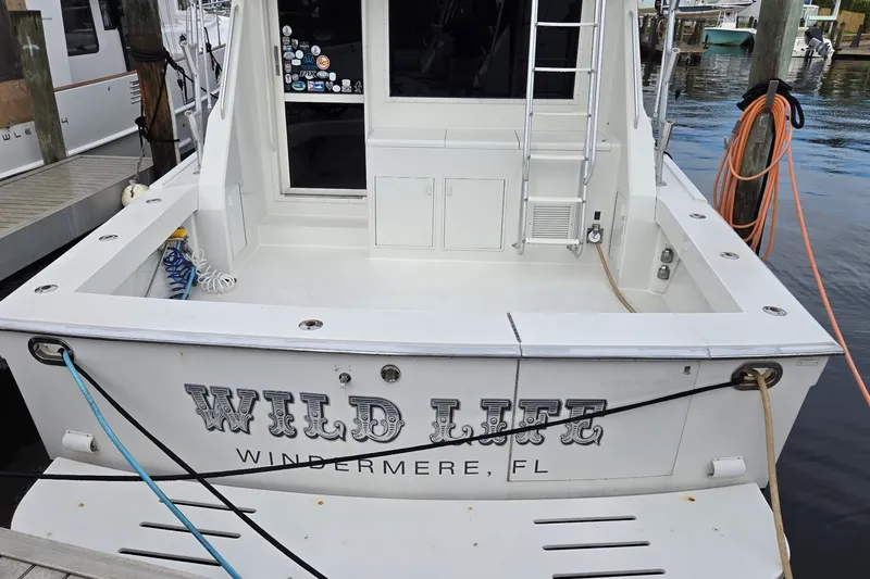 Slide: The Image of 1989 Viking 45 Convertible boat named "Wild Life" docked in Windermere, FL. - 2