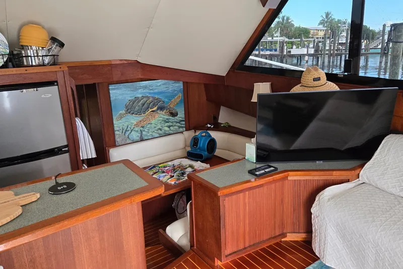 Slide: The Image of Interior of 1989 Viking 45 Convertible yacht with modern amenities and turtle artwork. - 18