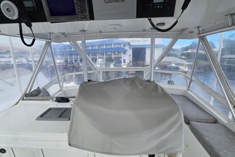 Slide: The Image of 1989 Viking 45 Convertible boat interior with navigation equipment and marina view. - 11