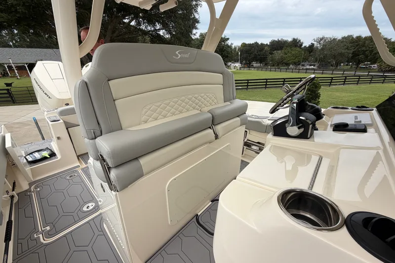 Slide: The Image of 2026 Scout 330 LXF boat interior with luxurious seating and modern helm controls. - 34