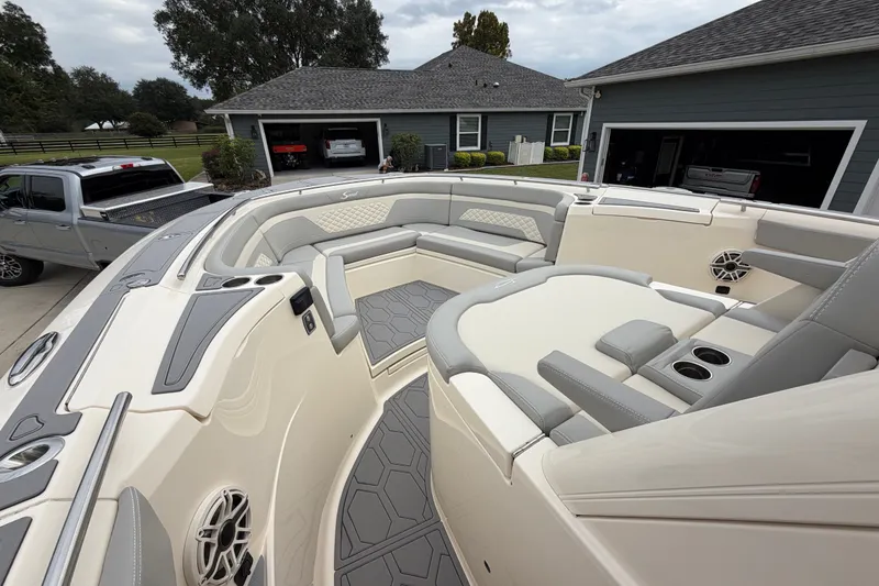 Slide: The Image of 2026 Scout 330 LXF boat interior with luxurious seating and modern design. - 16