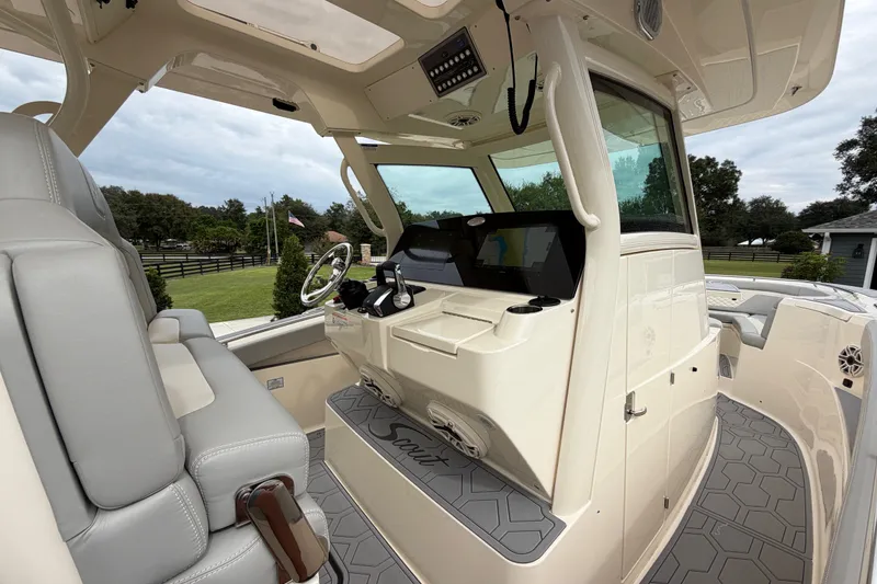 Slide: The Image of 2026 Scout 330 LXF boat interior with modern helm and seating. - 35