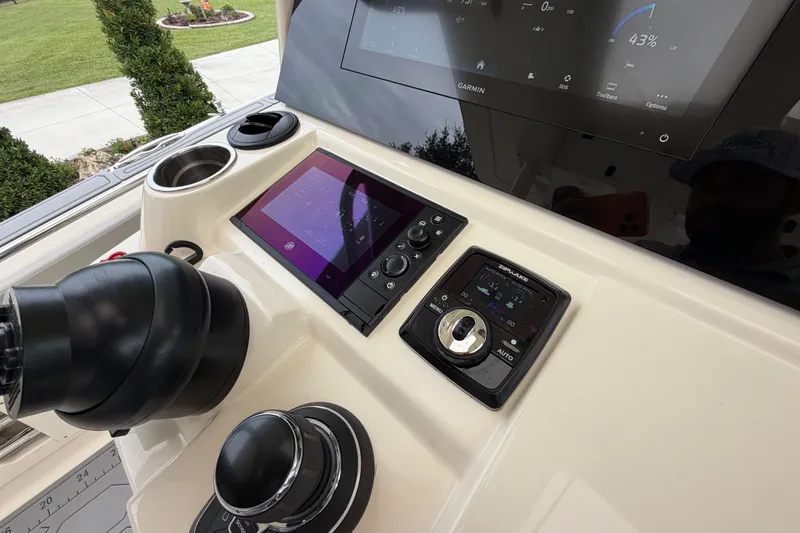 Slide: The Image of Control panel of 2026 Scout 330 LXF boat with advanced navigation systems. - 41