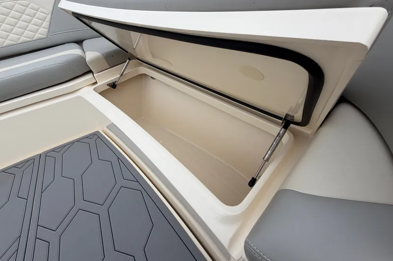 Slide: The Image of Open storage compartment in 2026 Scout 330 LXF boat interior. - 20