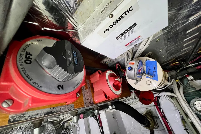 Slide: The Image of Engine room components of a 2000 Ocean Alexander 430 Classicco yacht, featuring Dometic equipment. - 58