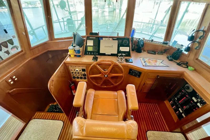 Slide: The Image of Pilothouse of 2000 Ocean Alexander 430 Classicco with navigation equipment and wooden steering wheel. - 23