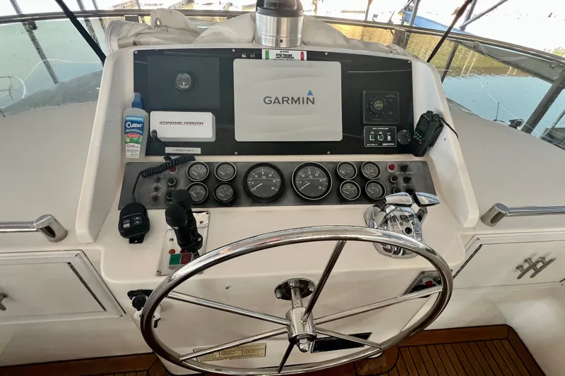 Slide: The Image of Helm of 2000 Ocean Alexander 430 Classicco with Garmin navigation system and steering wheel. - 53