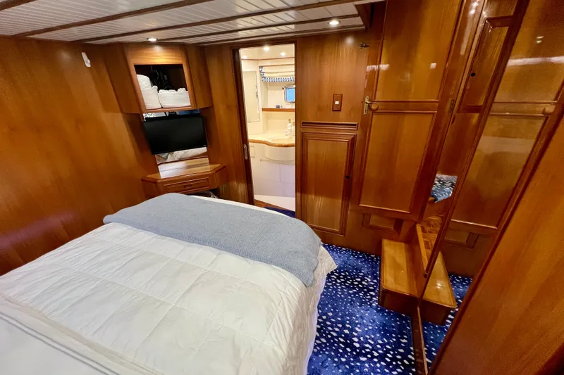Slide: The Image of Luxurious cabin interior of 2000 Ocean Alexander 430 Classicco yacht with wood paneling. - 34