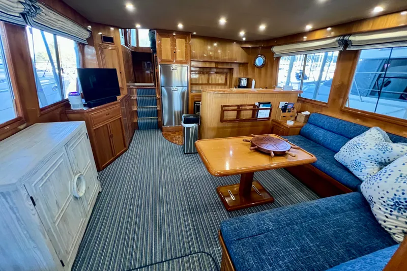 Slide: The Image of Luxurious interior of 2000 Ocean Alexander 430 Classicco yacht with wood finishes and cozy seating. - 9