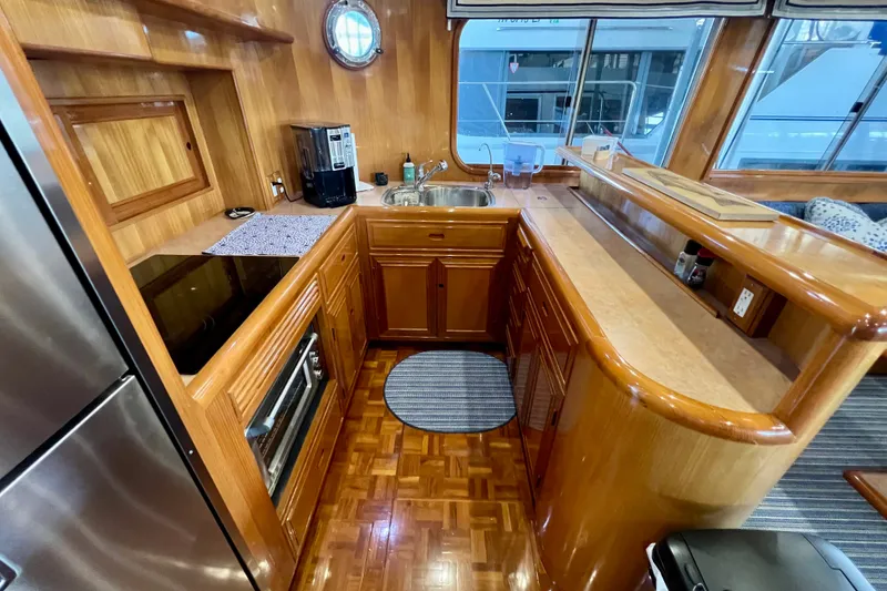 Slide: The Image of Luxurious wooden kitchen interior of 2000 Ocean Alexander 430 Classicco yacht. - 14