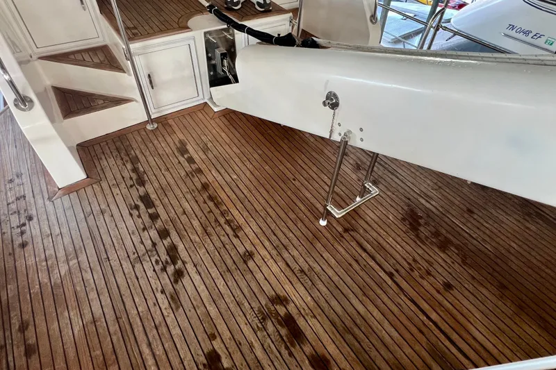 Slide: The Image of Teak deck of 2000 Ocean Alexander 430 Classicco yacht, featuring clean lines and polished wood. - 49