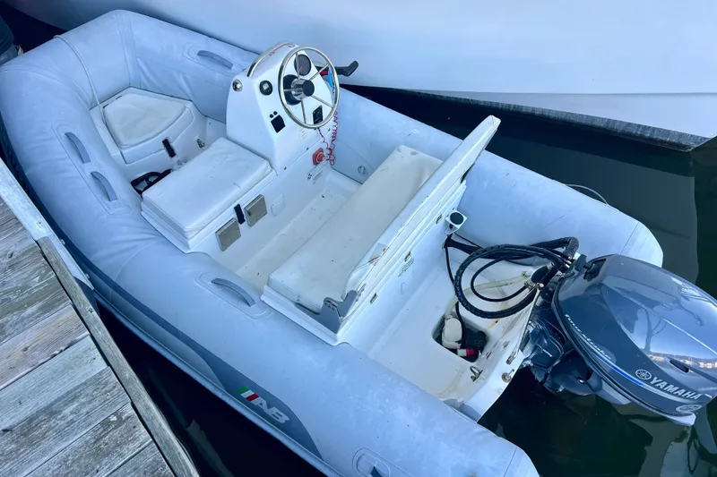 Slide: The Image of Inflatable boat with Yamaha motor docked beside Ocean Alexander 430 Classicco, 2000 model. - 70