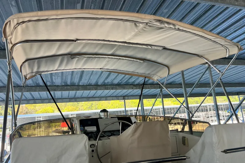 Slide: The Image of 2000 Ocean Alexander 430 Classicco boat with covered helm under metal roof. - 54