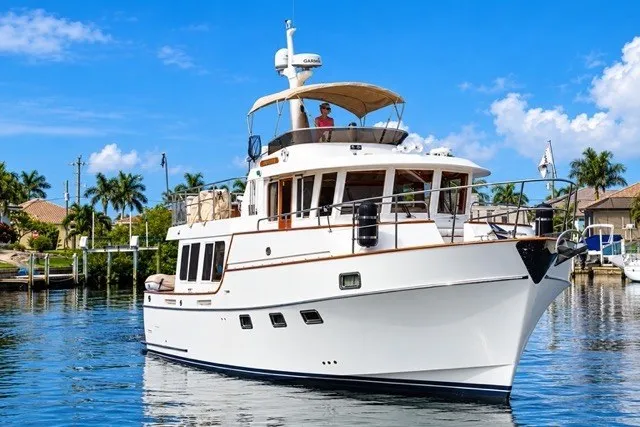 Slide: The Image of Ocean Alexander 430 Classicco yacht, 2000 model, cruising in a sunny waterfront setting. - 1