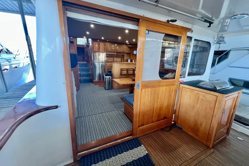 Slide: The Image of Interior view of 2000 Ocean Alexander 430 Classicco yacht with wooden finishes and modern amenities. - 6