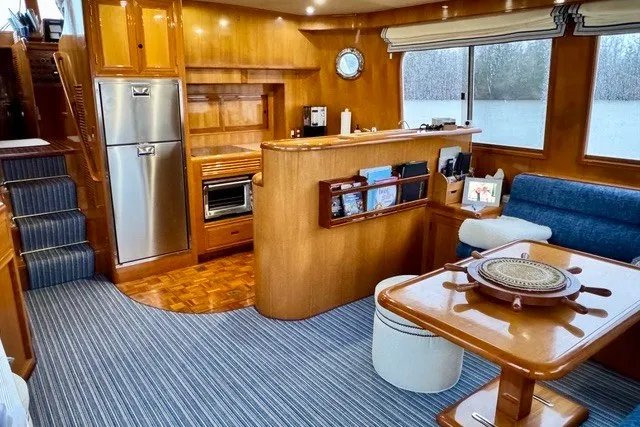Slide: The Image of Luxurious interior of 2000 Ocean Alexander 430 Classicco yacht with wood finishes and modern amenities. - 10