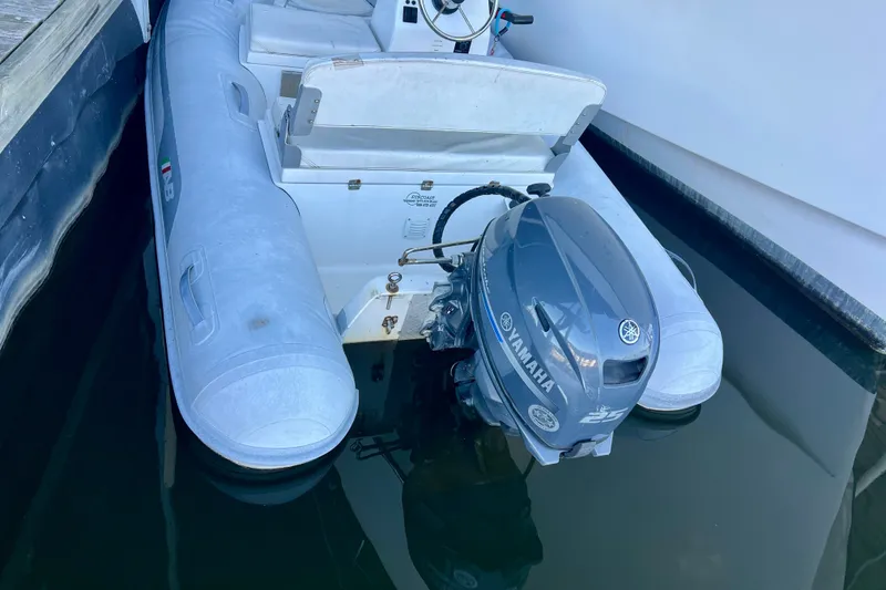 Slide: The Image of Inflatable boat with Yamaha outboard motor, docked beside Ocean Alexander 430 Classicco, 2000 model. - 69
