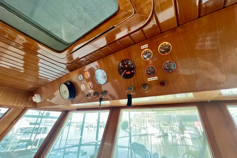 Slide: The Image of Control panel of 2000 Ocean Alexander 430 Classicco yacht with wooden finish and gauges. - 27