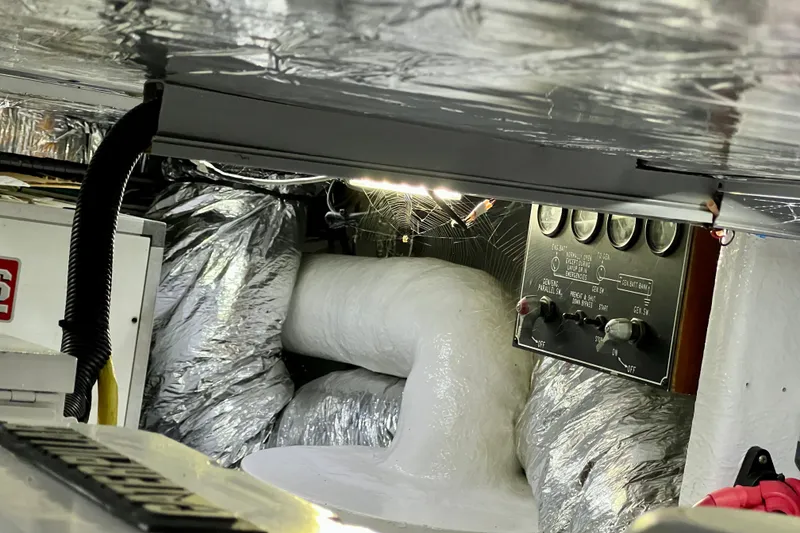 Slide: The Image of Engine room of 2000 Ocean Alexander 430 Classicco with control panel and insulation. - 63