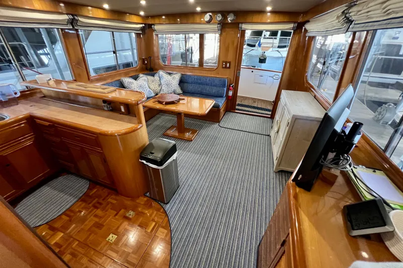Slide: The Image of Luxurious interior of 2000 Ocean Alexander 430 Classicco yacht with wood finishes and cozy seating. - 12