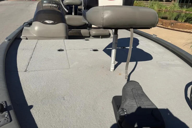 Slide: The Image of 2003 Tracker Tournament V-18 boat interior with seating and control panel. - 15