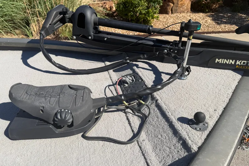Slide: The Image of 2003 Tracker Tournament V-18 boat with Minn Kota trolling motor on deck. - 14