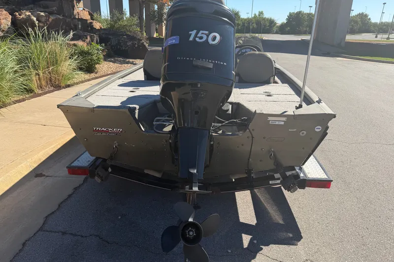 Slide: The Image of 2003 Tracker Tournament V-18 boat with 150 horsepower outboard motor on trailer. - 17