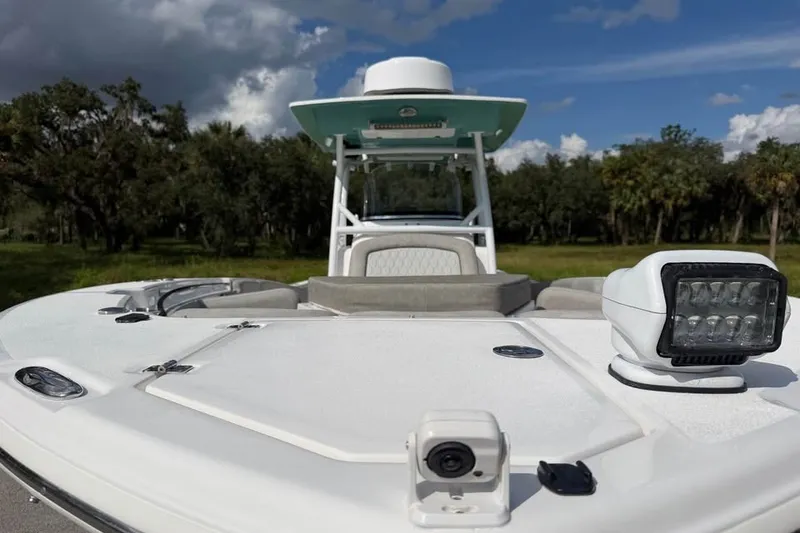 Slide: The Image of 2021 Sea Fox 288 Commander boat with spotlight and camera, set against a scenic backdrop. - 18