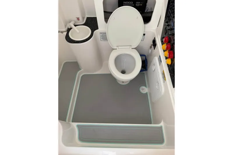 Slide: The Image of 2021 Sea Fox 288 Commander boat bathroom with toilet and sink. - 16