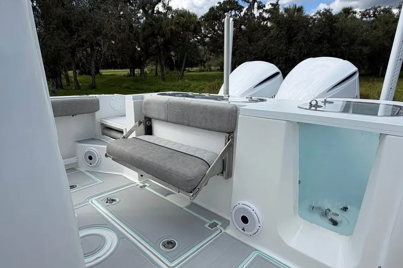 Slide: The Image of 2021 Sea Fox 288 Commander boat interior with seating and dual engines. - 13