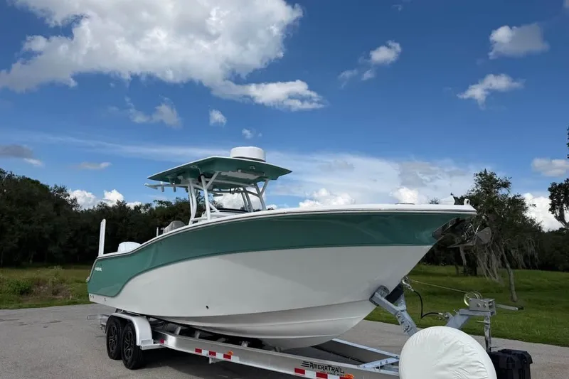 The Image of 2021 Sea Fox 288 Commander boat on trailer under blue sky. - 0
