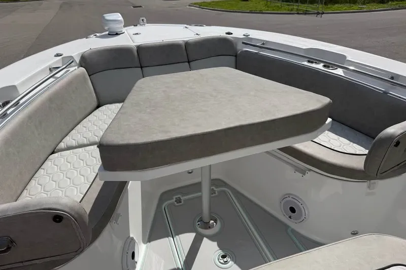 Slide: The Image of 2021 Sea Fox 288 Commander boat interior with cushioned seating and table. - 14