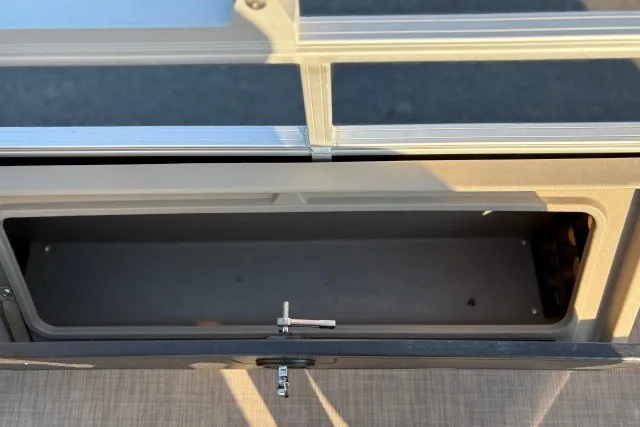 Slide: The Image of 2020 Sun Tracker SportFish 22 XP3 storage compartment with open lid, showcasing interior space. - 38