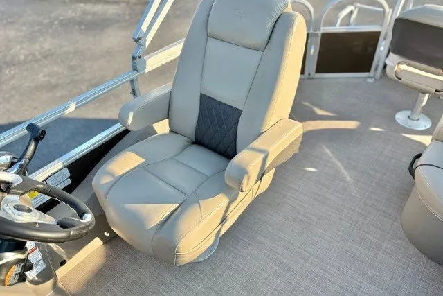 Slide: The Image of Captain's chair on 2020 Sun Tracker SportFish 22 XP3 pontoon boat, featuring beige upholstery. - 29
