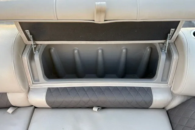 Slide: The Image of 2020 Sun Tracker SportFish 22 XP3 boat seat storage compartment open. - 35