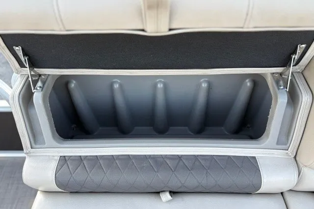 Slide: The Image of 2020 Sun Tracker SportFish 22 XP3 boat seat storage compartment, open with visible interior. - 27