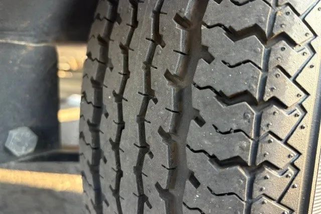 Slide: The Image of Close-up of a tire tread on a 2020 Sun Tracker SportFish 22 XP3. - 56